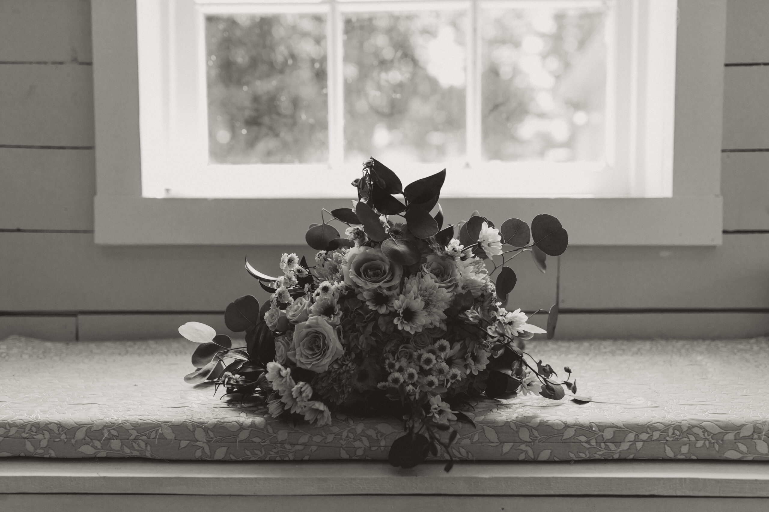 bridal bouquet laying on bench