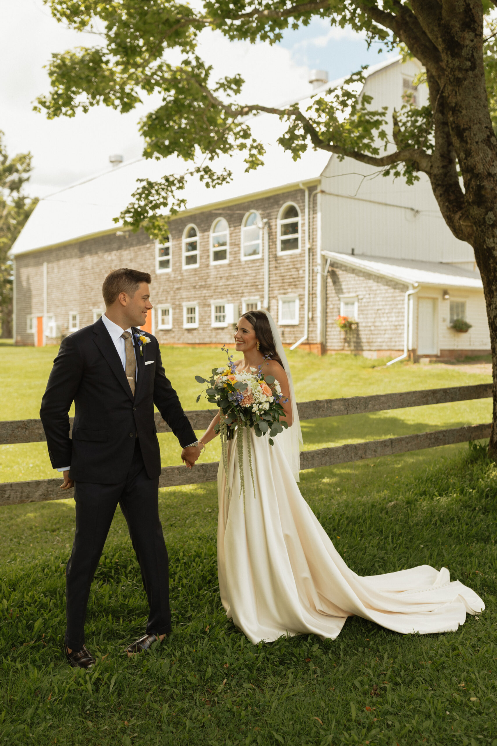 bride and groom outside during first look at New London Carriage House in PEI