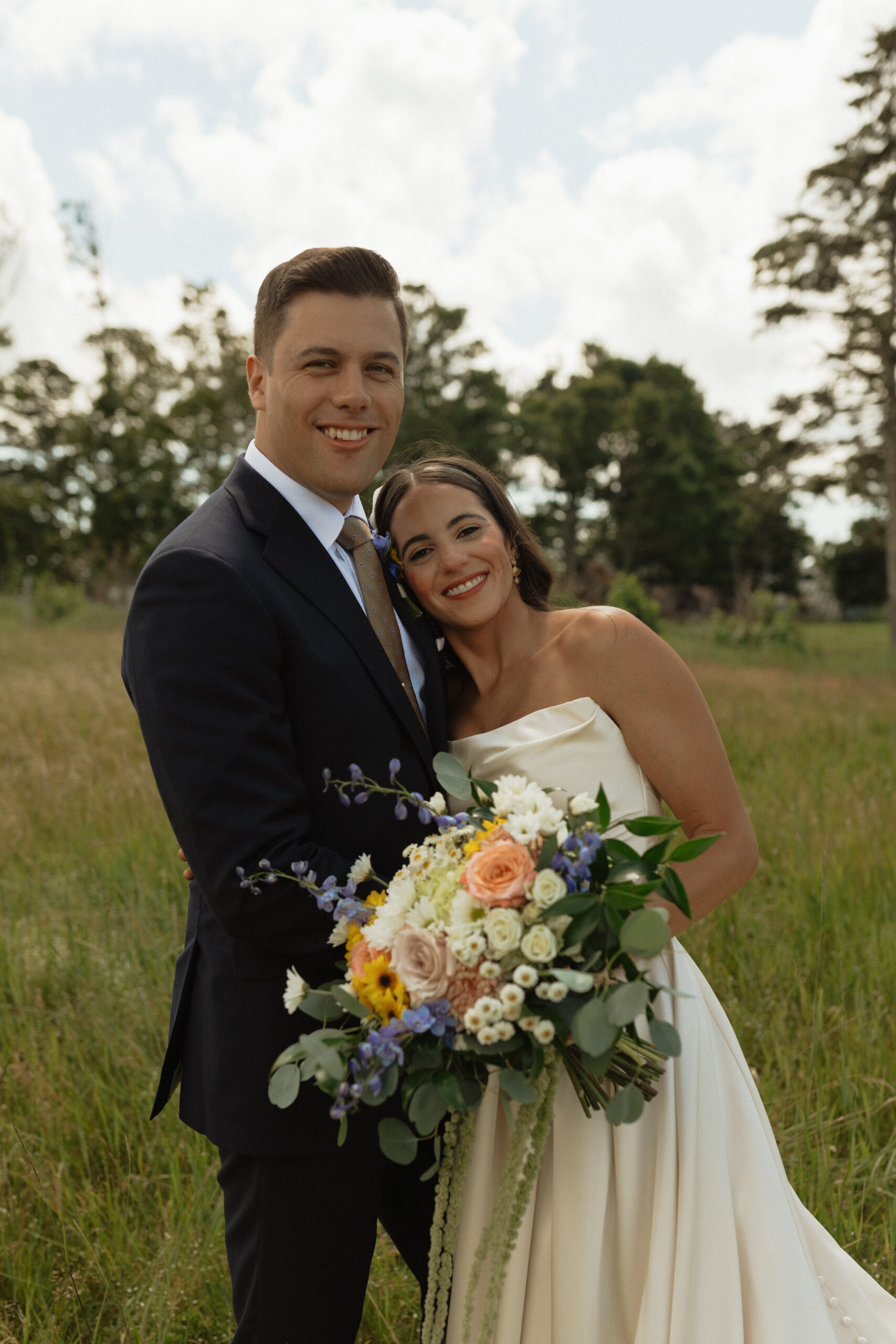 bride and groom smiling