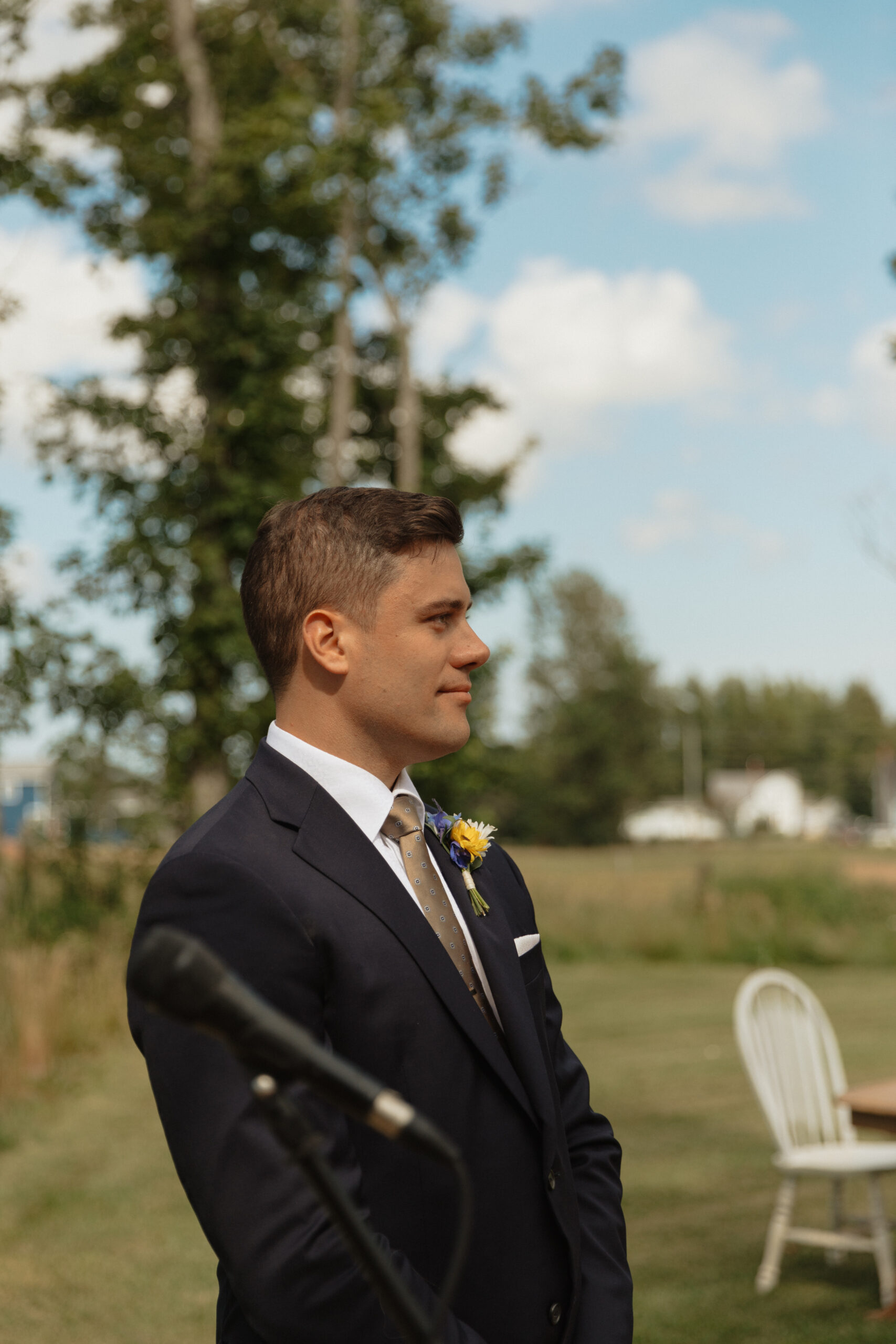 groom watching bride walk up the aisle