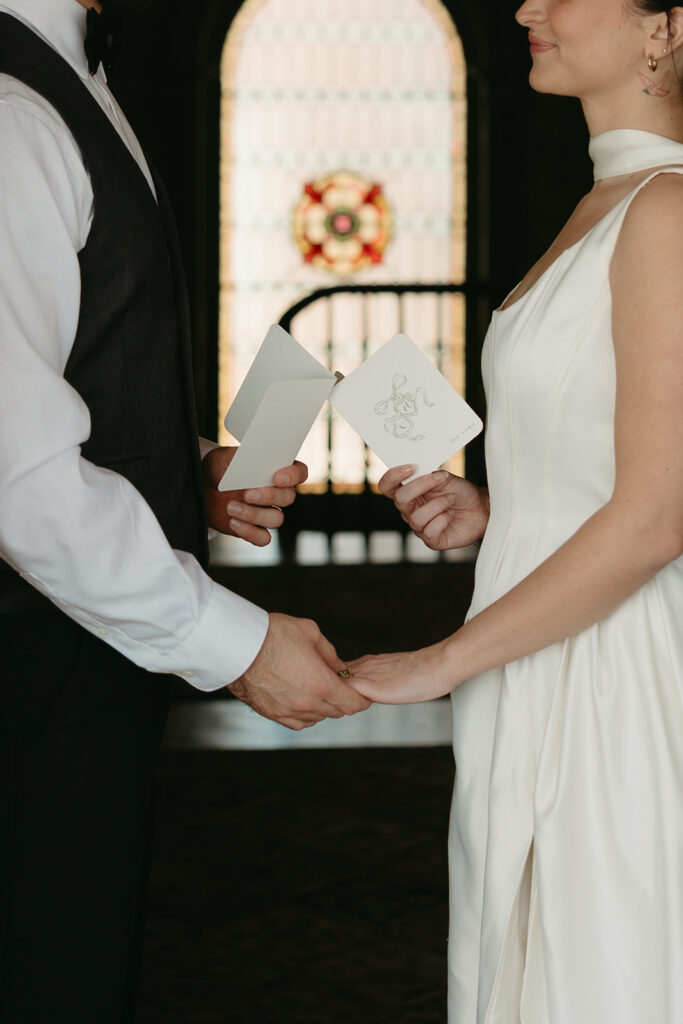 close up photo of bride and groom reading vows